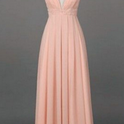 A Pale Pink Ball Gown And A Sleeveless Gown With A..