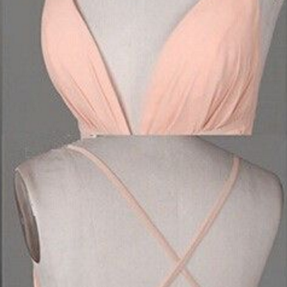 A Pale Pink Ball Gown And A Sleeveless Gown With A..