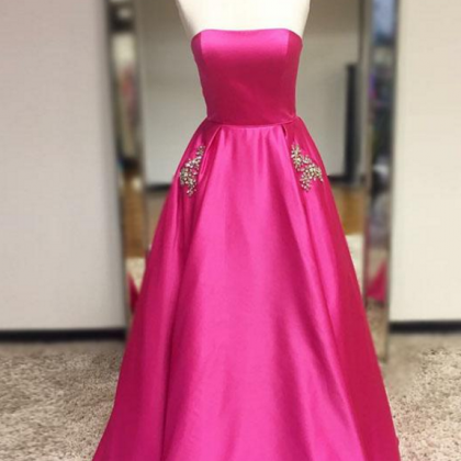A Long Gown With A Purplish Red Belt And An..