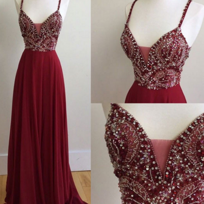 A Long, Dark Red Beaded Gown With A Long Gown And..