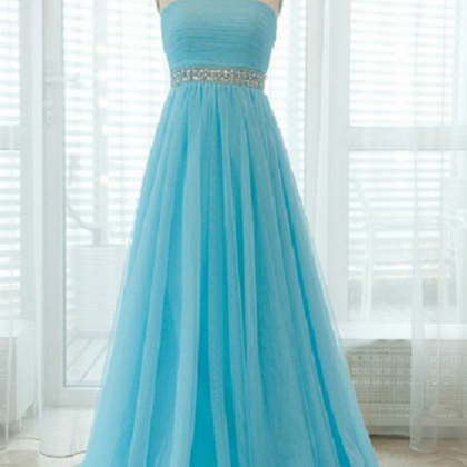 A Strapless Long Blue Dress With Pleated Bodice..