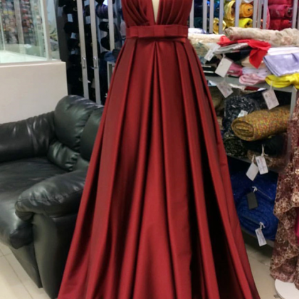 A Low-necked Gown With A Fine Shoulder And A Red..