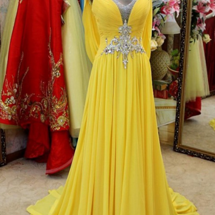 A Beaded, Yellow Dress With A Yellow Dress And A..
