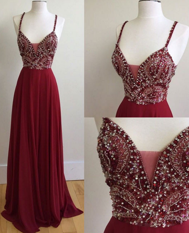 A Long, Dark Red Beaded Gown With A Long Gown And Evening Gown.