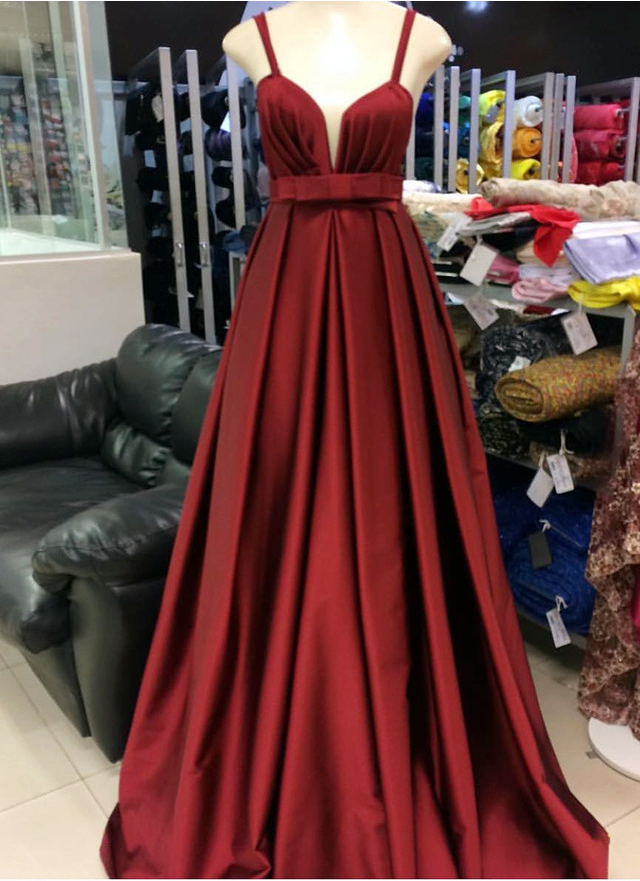 A Low-necked Gown With A Fine Shoulder And A Red Cocktail Dress.