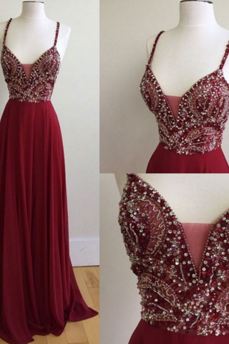 A Long, Dark Red Beaded Gown With A Long Gown And Evening Gown.