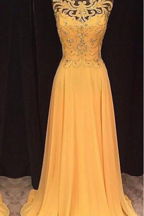A lacy yellow ball gown with an evening dress.