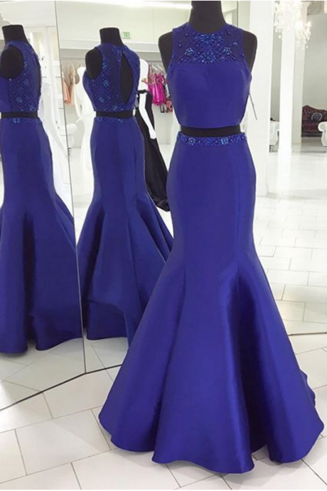 A Ball Gown With A Keyhole And Two Blue Dresses.