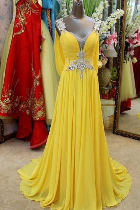 A Beaded, Yellow Dress With A Yellow Dress And A Strapless Evening Gown.